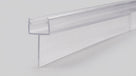 Clear PVC tapered seal profile side on against pale grey, narrow channel above a long sloping fin