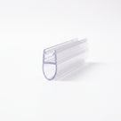 Clear seal offcut on white at an angle, glass channel above a long hollow teardrop bubble