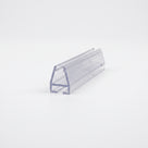 Clear seal offcut angled on white, tapered glass channel raised on a flat base foot