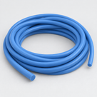 Mid-blue glossy silicone cord wound in several turns, seen at an angle with both round cut ends showing