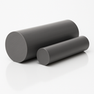 Pair of dark grey uPVC billets on a glossy white surface, the larger in front with its sawn face to the left