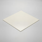 Square cream nylon sheet laid flat on a pale grey background, thin edge visible at the near corner