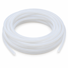Milky translucent silicone cord coiled flat in many even turns on white, both round cut ends visible