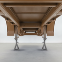 Vehicle chassis freshly painted brown underbody protective coating in UK workshop