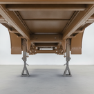 Vehicle chassis freshly painted brown underbody protective coating in UK workshop