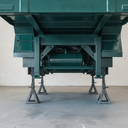 Vehicle chassis freshly painted dark green underbody protective coating in UK workshop