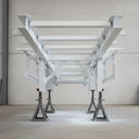 Vehicle chassis freshly painted white underbody protective coating in UK workshop